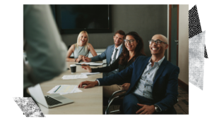 Diverse Group in conference room laughing